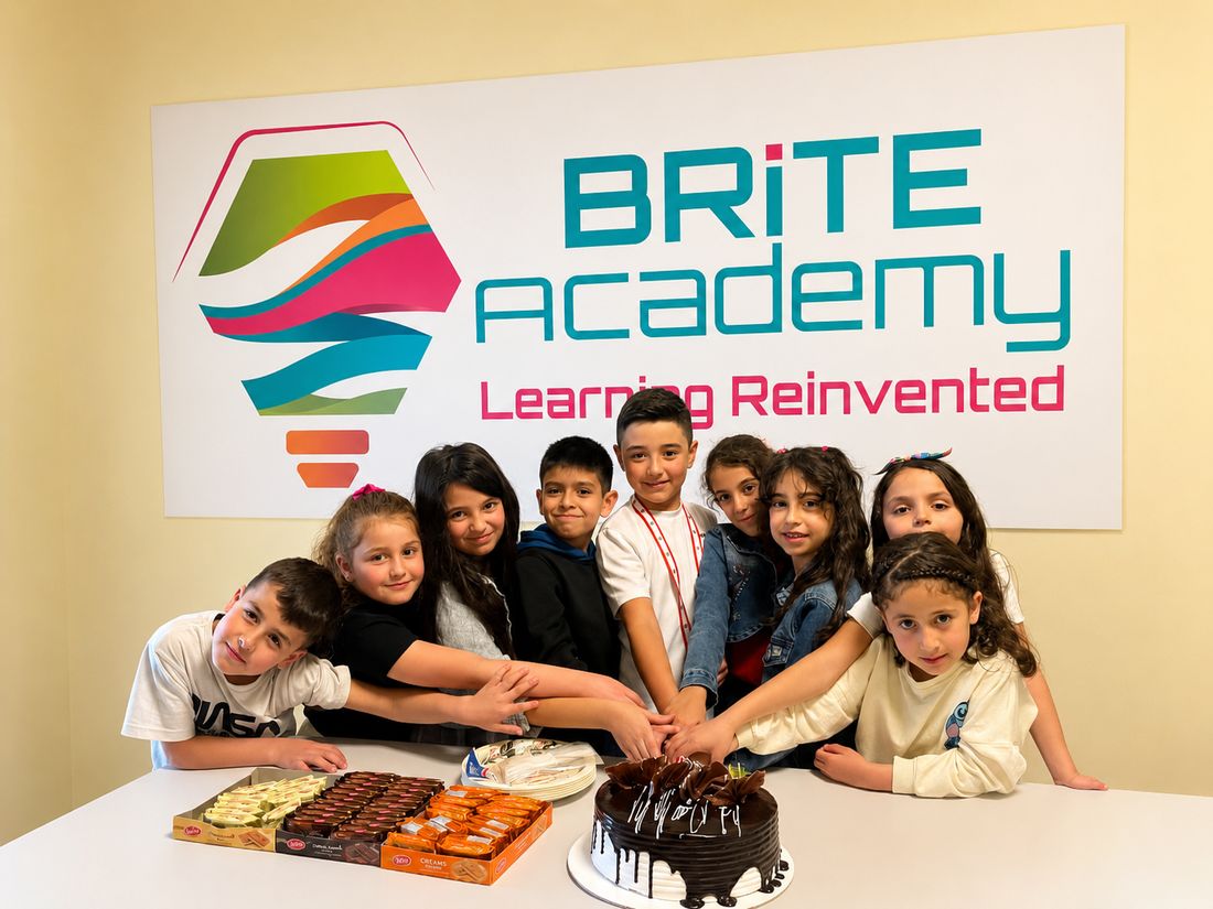 Brite Academy kids celebrating together in front of the Brite Academy sign