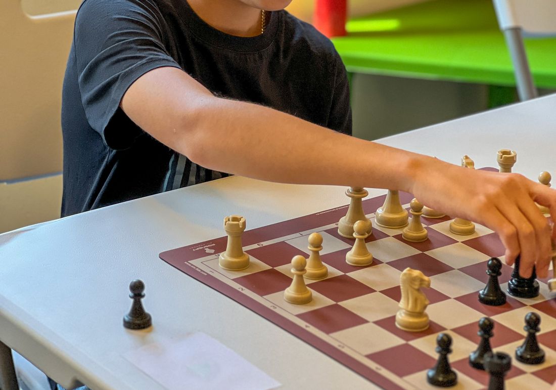 Two children playing chess